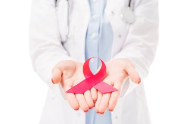 cropped shot of female doctor holding aids awareness red ribbon symbol isolated on white clipart