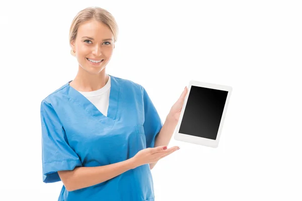 Smiling Young Nurse Pointing Tablet Blank Screen Isolated White — Stock Photo, Image