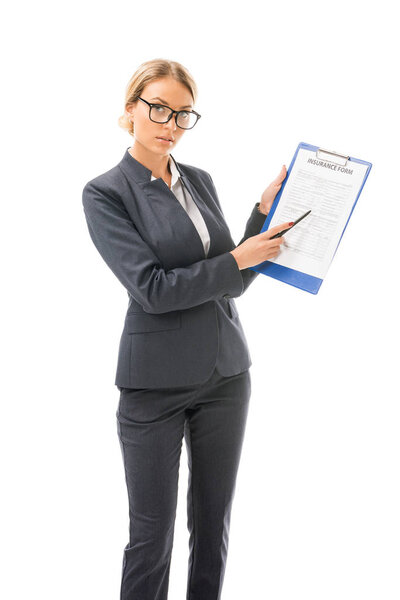 confident young businesswoman showing clipboard with documents isolated on white