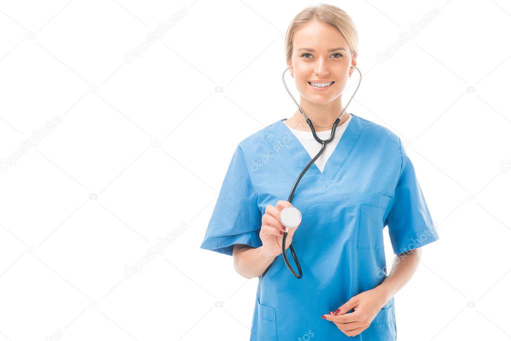 smiling young nurse with stethoscope looking at camera isolated on white