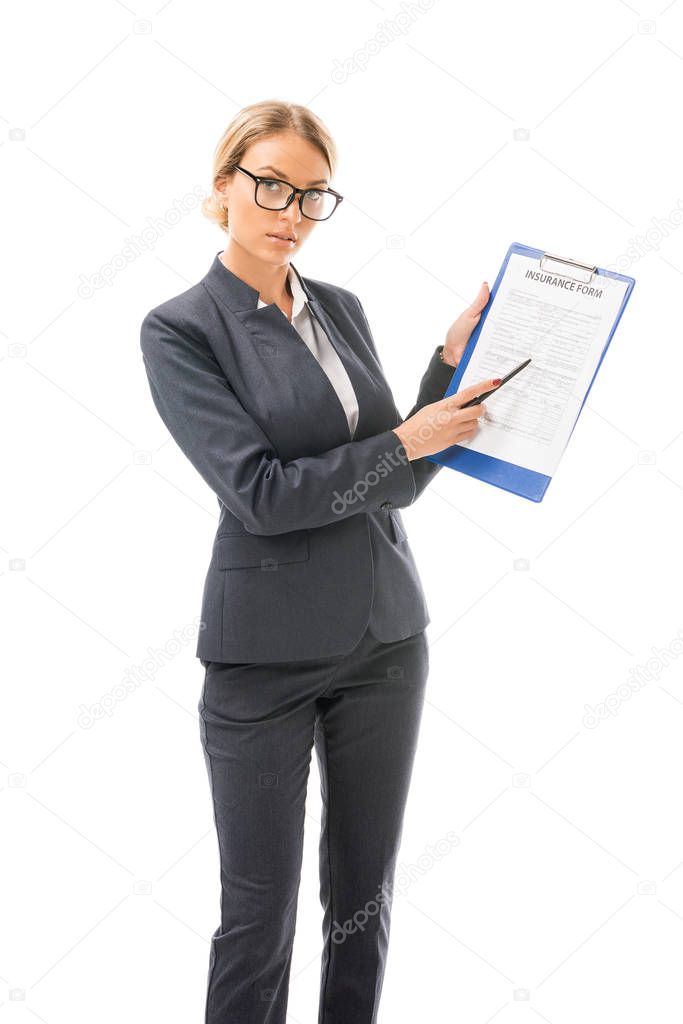 confident young businesswoman showing clipboard with documents isolated on white
