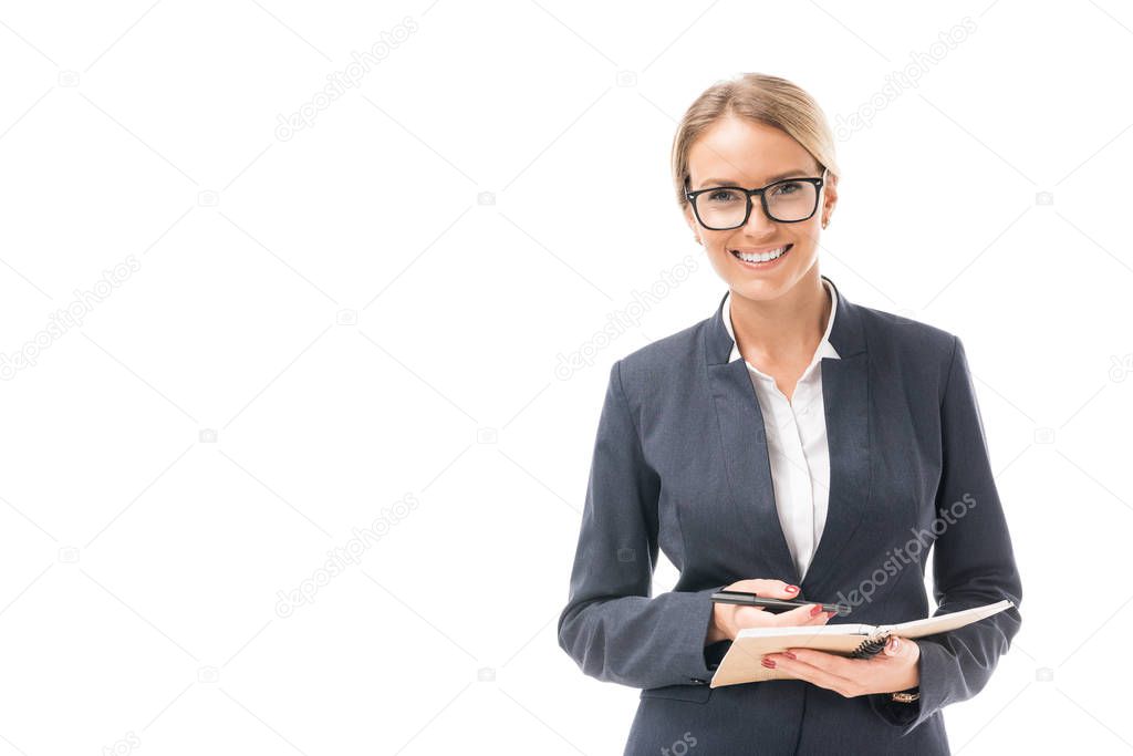 beautiful young businesswoman with notebook looking at camera isolated on white