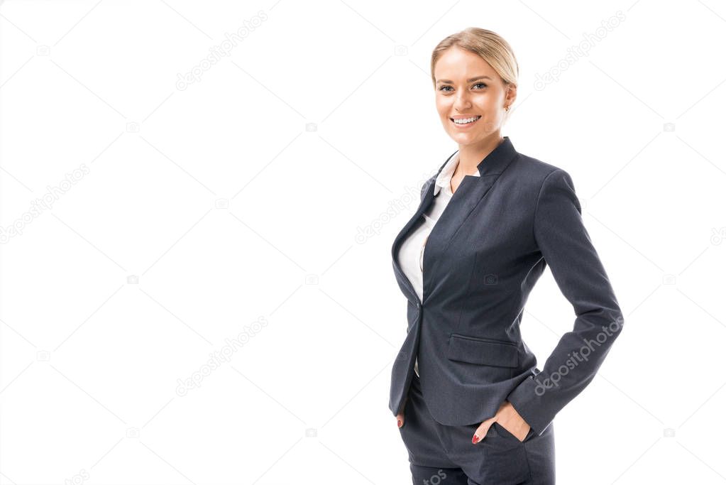 beautiful young businesswoman in suit looking at camera isolated on white
