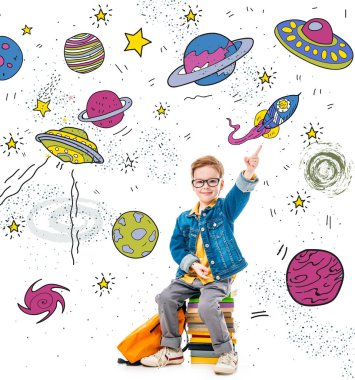 smiling schoolboy pointing up while sitting on pile of books with backpack, isolated on white with fantasy universe, planets and spaceships clipart
