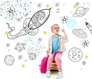 excited schoolchild pointing up and having idea while sitting on pile of books with backpack isolated on white with fantasy universe, spaceships and planets clipart