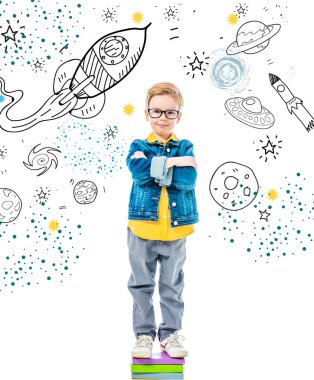 pupil with crossed arms standing on pile of books, isolated on white with space, stars and planets clipart