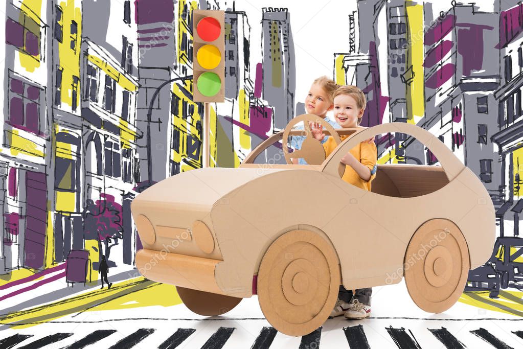 brother and sister playing with cardboard car and traffic lights on street in drawn city