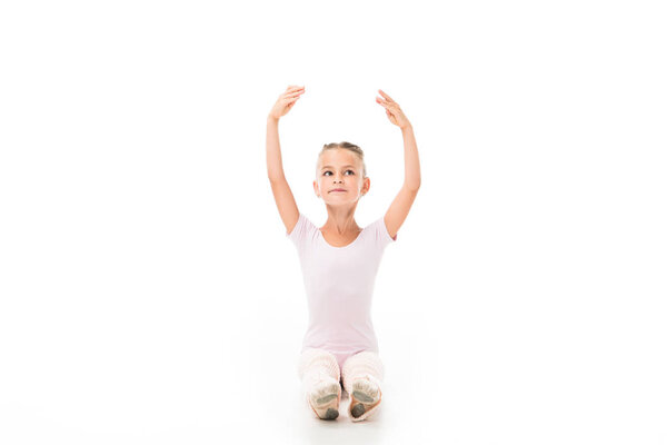 beautiful little ballerina practicing isolated on white background 