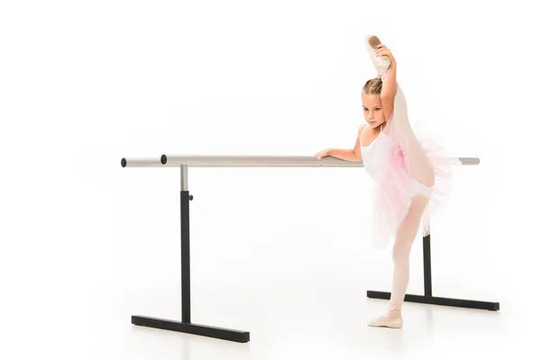 Little Ballerina Tutu Stretching Leg Ballet Barre Stand Isolated White — Free Stock Photo