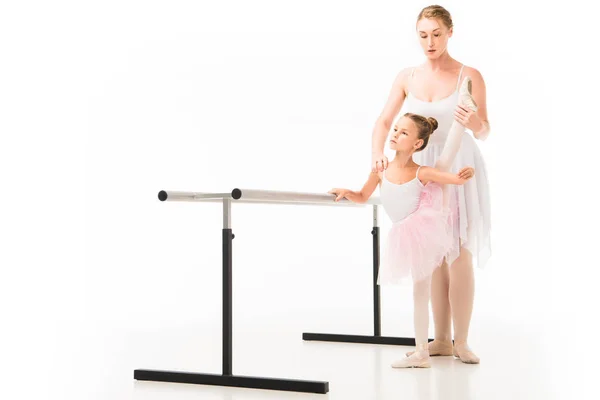 Focused Female Teacher Tutu Helping Little Ballerina Practicing Ballet Barre — Stock Photo, Image