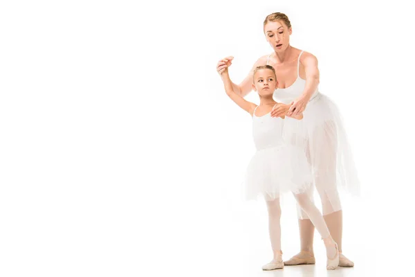 Serious Female Trainer Tutu Helping Little Ballerina Exercising Isolated White — Stock Photo, Image