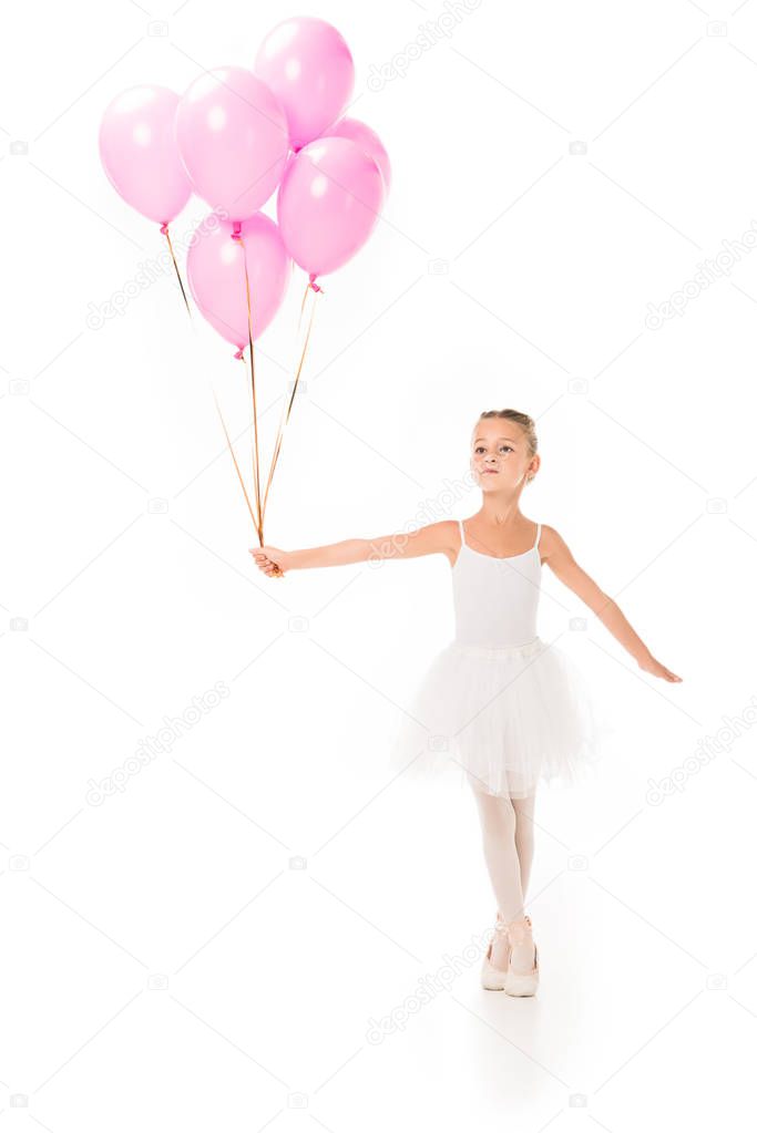 little ballerina in tutu dancing with pink balloons isolated on white background 