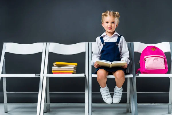 Adorable Schoolgirl Sitting Chairs Books Backpack — Stock Photo, Image