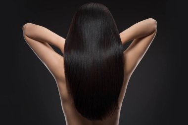 back view of woman with beautiful shiny hair isolated on black clipart