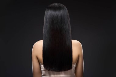 back view of woman with beautiful shiny hair isolated on black clipart