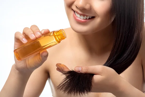 Cropped Shot Smiling Woman Pouring Oil Split Ends Isolated White — Stock Photo, Image