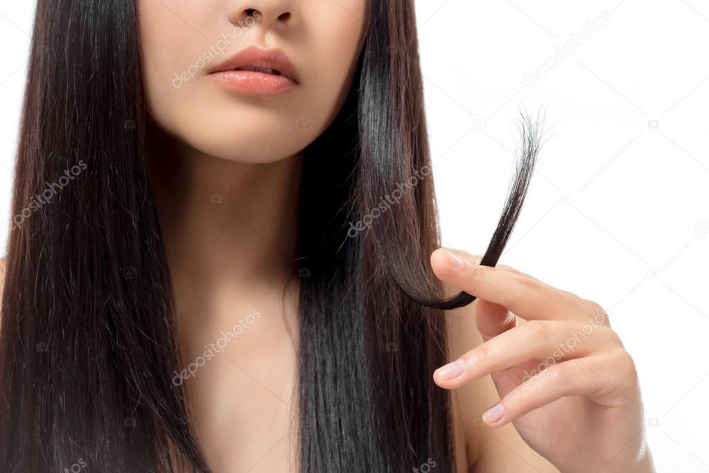 cropped shot of woman with damaged dark hair isolated on white, split ends concept