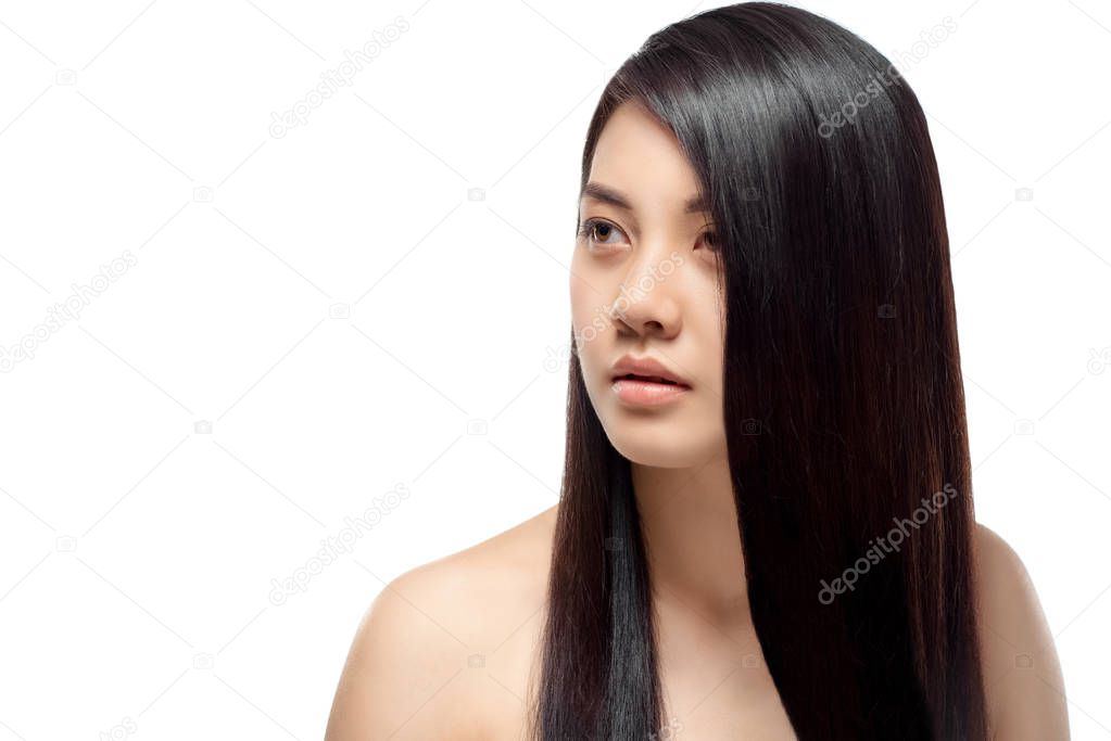 portrait of young asian woman with beautiful and healthy hair looking away isolated on white