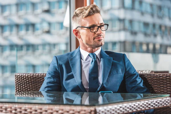 Handsome Cheerful Businessman Glasses Blue Suit Sitting Table Cafe Looking — Stock Photo, Image