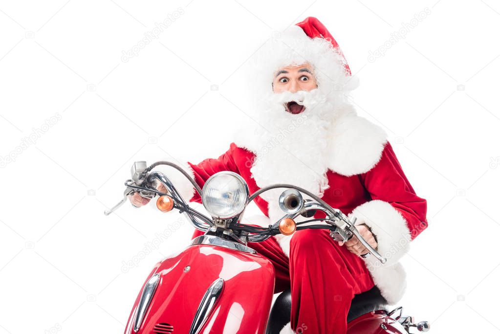 surprised santa claus in costume riding on scooter isolated on white background 