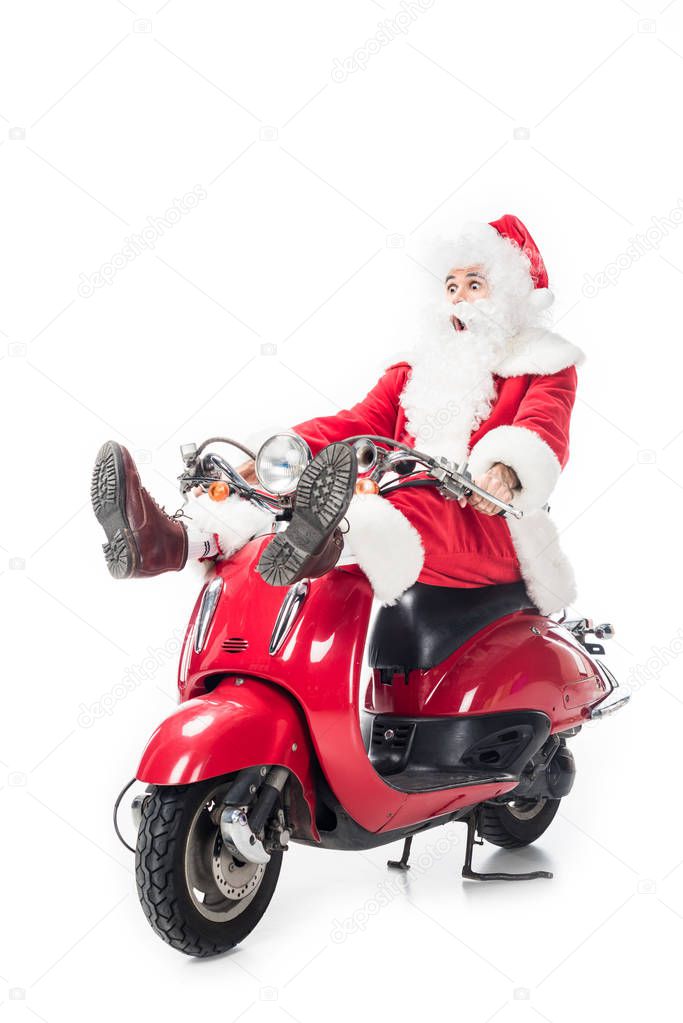 shocked santa claus in costume riding on scooter isolated on white background 