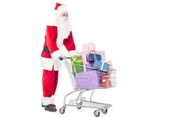 Zijaanzicht Van Kerstman Trolley Uitvoering Met Stapel Geschenkdozen Geïsoleerd Witte — Gratis stockfoto