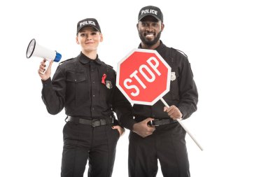 smiling police officers with stop road sign and megaphone looking at camera isolated on white, aids awareness concept clipart