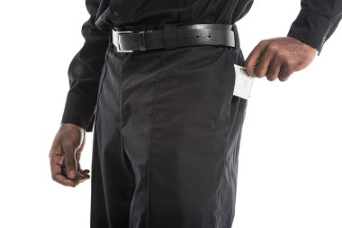 cropped shot of african american policeman taking condom from back pocket of pants, aids awareness concept clipart