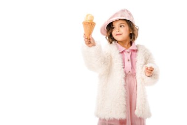 beautiful happy child in fur coat with ice cream isolated on white clipart