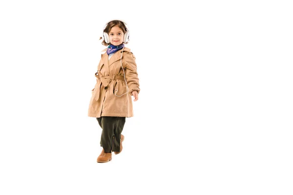 Happy Little Child Stylish Trench Coat Listening Music Headphones Isolated — Free Stock Photo