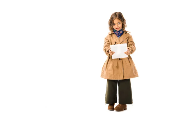 Beautiful Little Child Trench Coat Using Tablet Looking Camera Isolated — Free Stock Photo