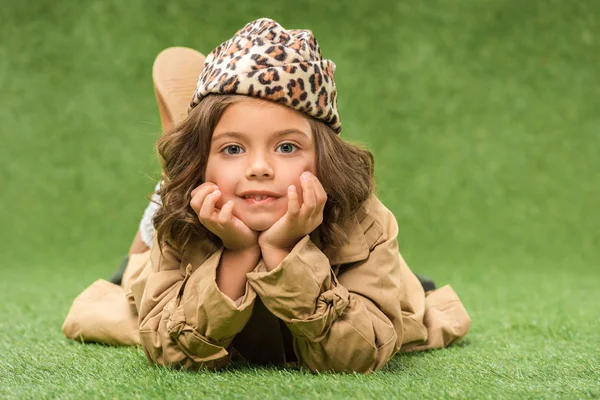 Stylish Little Kid Lying Green Grass — Free Stock Photo