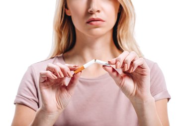 cropped image of blonde woman breaking unhealthy cigarette isolated on white clipart