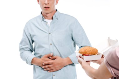 adamın beyaz izole burger teklif kadın mide ağrısı gösterilen kırpılmış görüntü