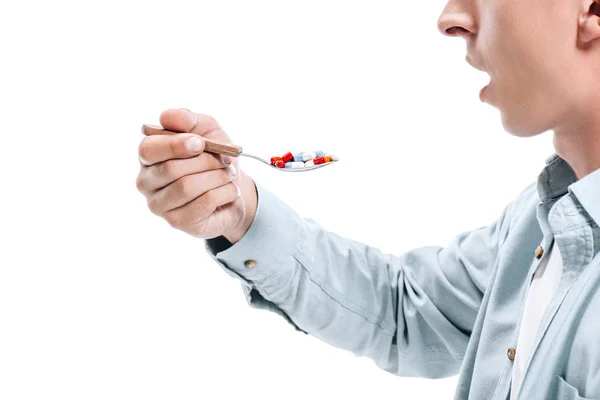 Immagine Ritagliata Uomo Con Bocca Aperta Tenendo Cucchiaio Pillole Colorate — Foto Stock