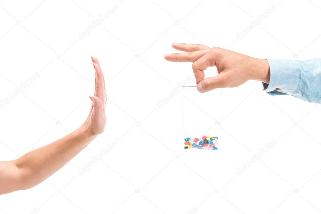 cropped image of woman rejecting unhealthy pills isolated on white