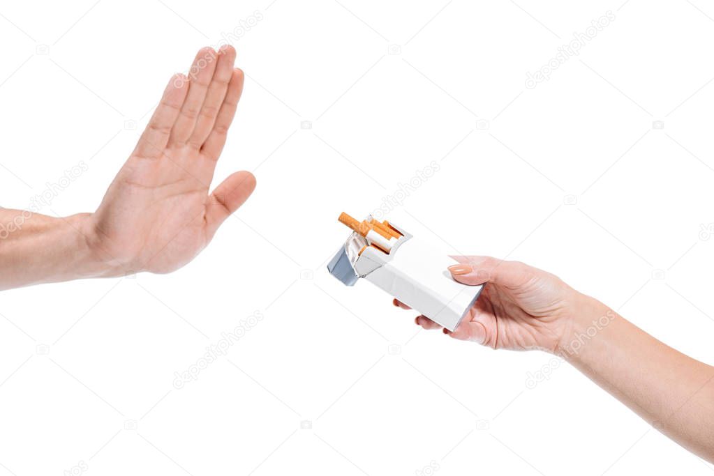 cropped image man rejecting pack of cigarettes from woman isolated on white