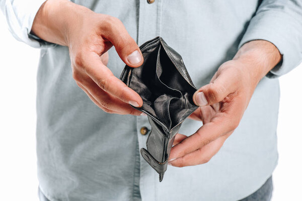 cropped image of man holding empty black purse isolated on white