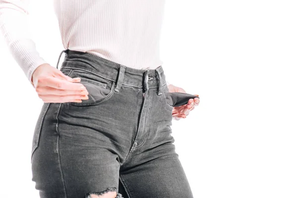 Bijgesneden Afbeelding Van Meisje Met Lege Jeans Zakken Geïsoleerd Wit — Stockfoto