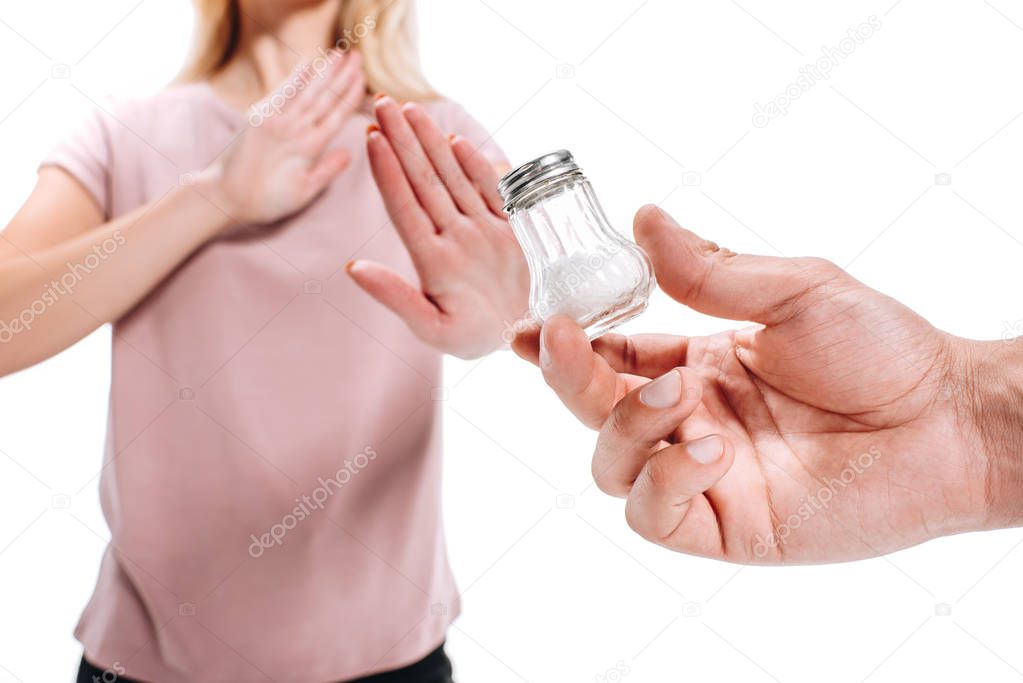 cropped image of woman rejecting unhealthy salt isolated on white