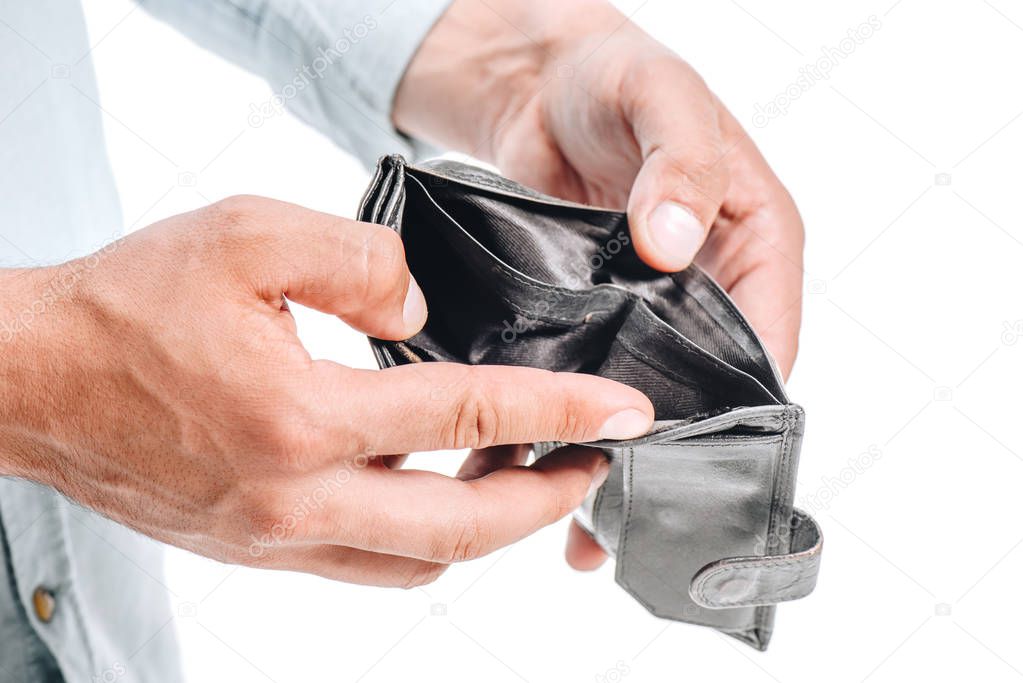 cropped image of man opening empty black purse isolated on white