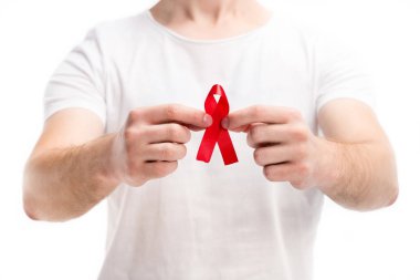 cropped image of man in white shirt showing red ribbon isolated on white, world aids day concept clipart