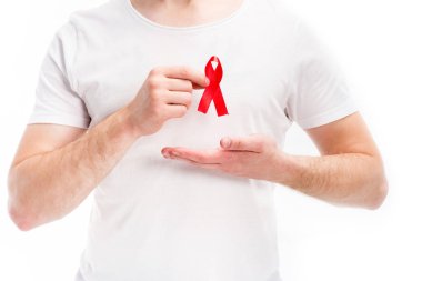 midsection of man showing red ribbon on shirt isolated on white, world aids day concept clipart