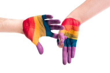 cropped image of gay couple showing penetration sign with hands painted in colors of pride flag isolated on white, world aids day concept clipart