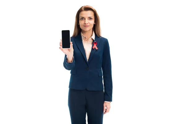 Attractive Businesswoman Red Ribbon Suit Showing Smartphone Blank Screen Isolated — Free Stock Photo