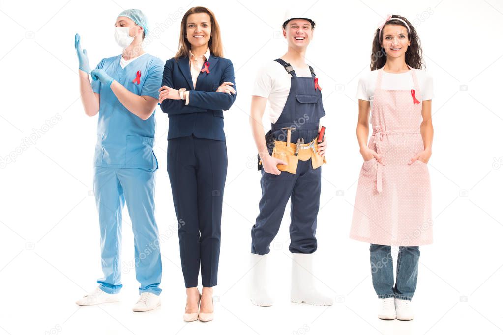 happy businesswoman, doctor, worker and housewife standing with red ribbons isolated on white, world aids day concept