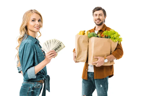 Young Positive Woman Showing Money While Her Boyfriend Standing Products — Stock Photo, Image