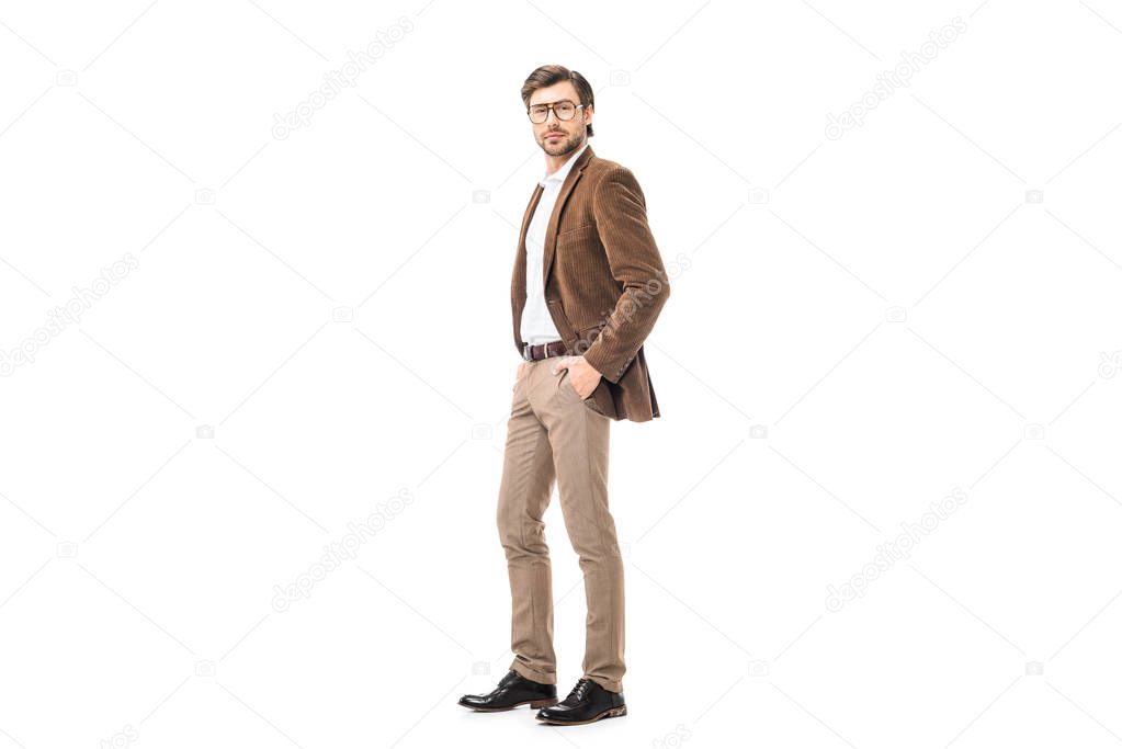 young man in eyeglasses and velvet jacket posing isolated on white