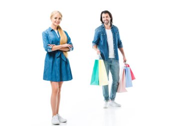 Man with shopping bags and happy woman after shopping isolated on white clipart