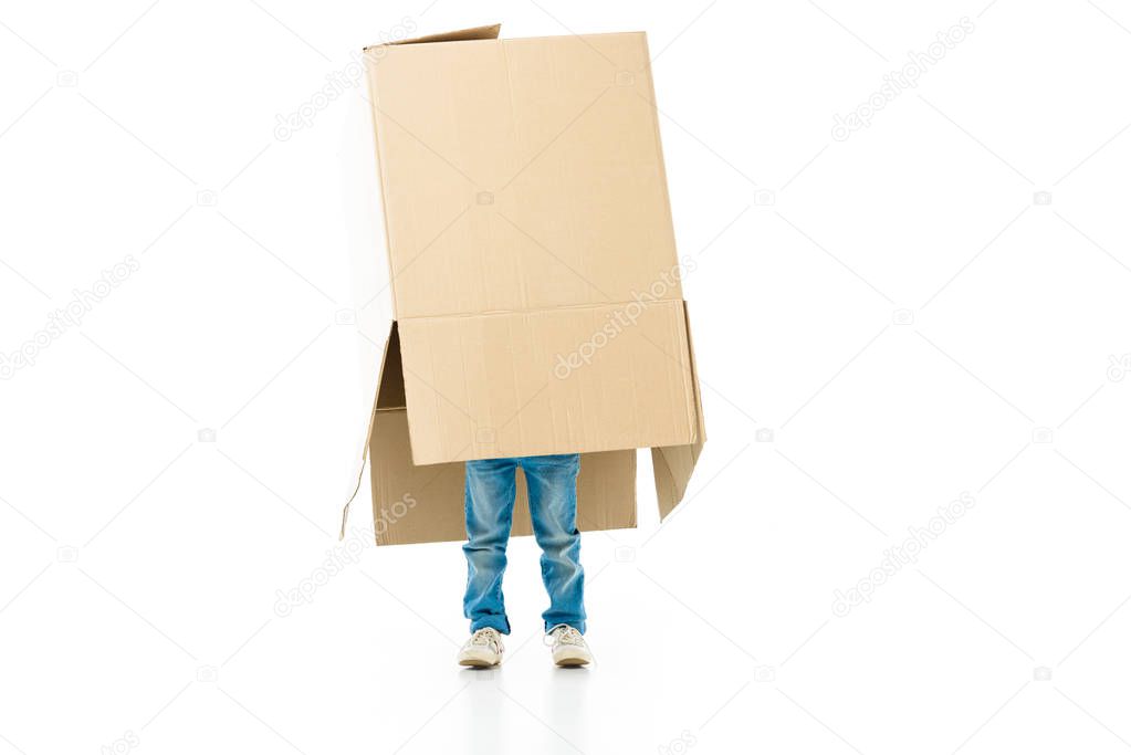 Child hiding in the paper box preparing for moving isolated on white